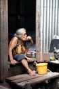 A old woman living in a slum